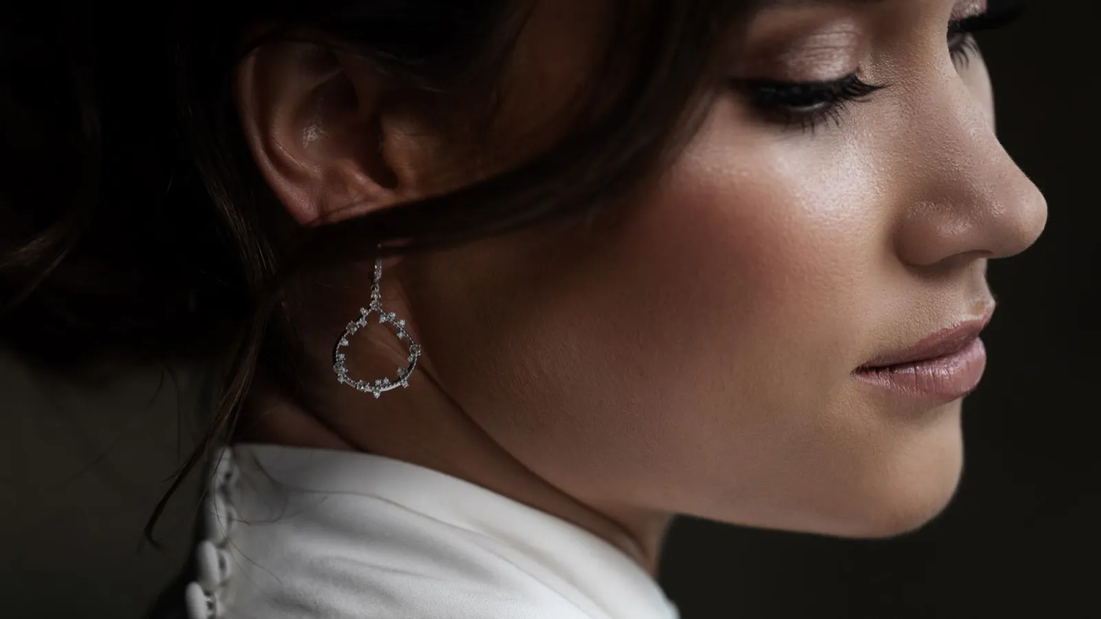 Jewellery campaign: close-up of a woman wearing a drop earring